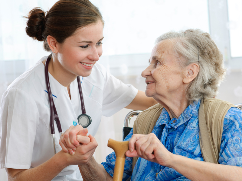 nurse helping patient