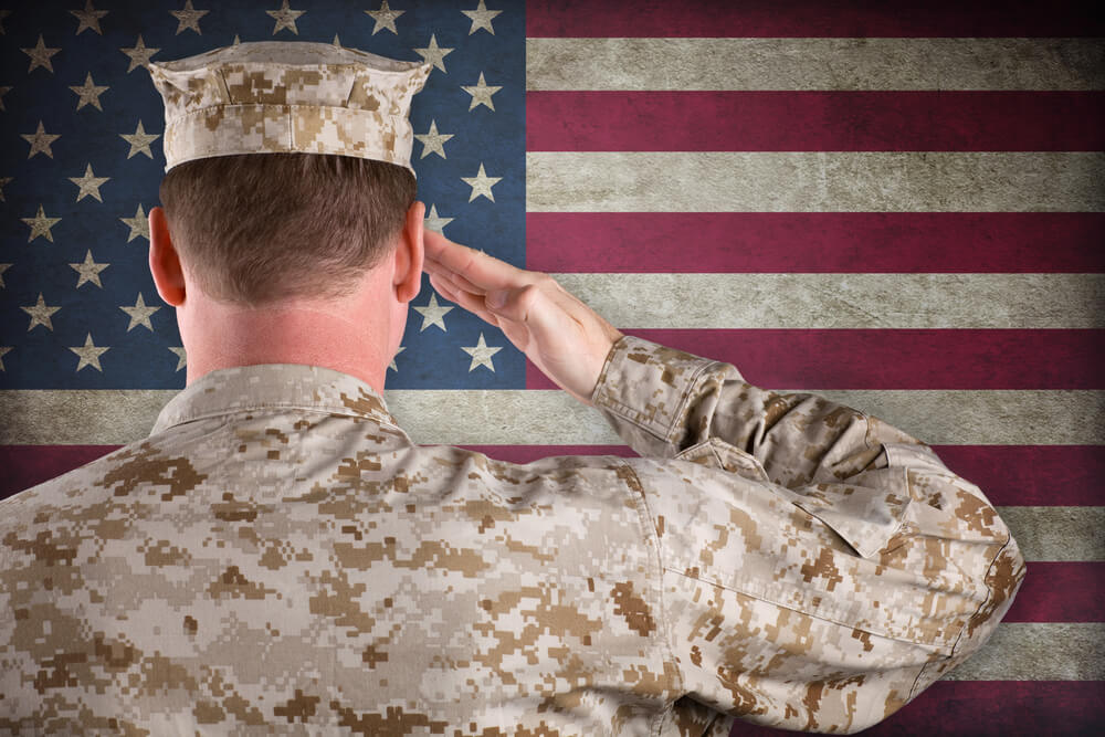 soldier saluting flag