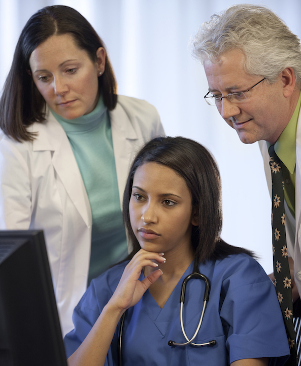 nurses looking at computer