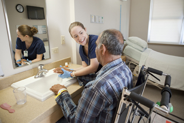 nurse helping senior patient 