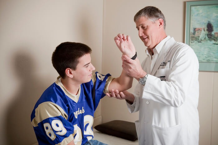 doctor examining patient