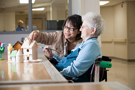 patient with nurse at table 